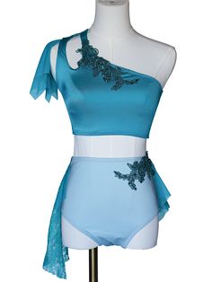 a mannequin wearing a blue and white one piece swimsuit with flowers on it