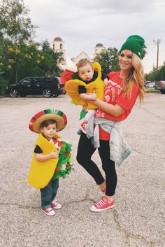 a woman and two children dressed up in costumes