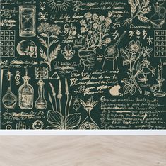 a green wallpaper with flowers, plants and writing on it in an old fashioned style