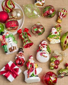 christmas ornaments are arranged on a table