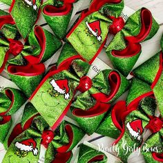 several green and red bows with angry birds on them are laying next to each other