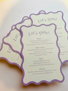 three purple and white menu cards on top of each other with the words let's dine