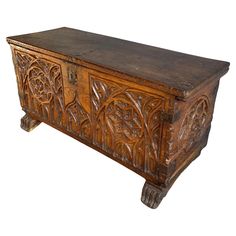 an old wooden chest with carvings on it