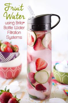 fruit water in a glass with strawberries, cucumbers and other fresh fruits