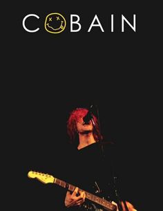 a man that is playing a guitar in front of a microphone with the words cobalt on it