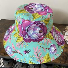 a colorful hat sitting on top of a wooden bench