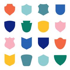 different shapes and colors of shields on a white background