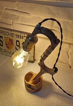 an old fashioned lamp is sitting on the table