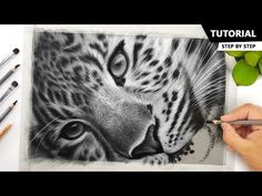 a drawing of a tiger's face with pencils next to it