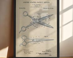 an old poster with scissors on it in front of a window that says united states patient office