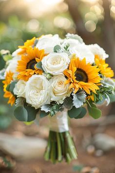 a bridal bouquet with sunflowers and roses