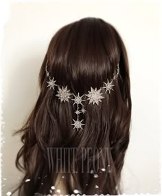 the back of a woman's head with flowers on it