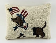 an embroidered pillow with a dog and american flag on it