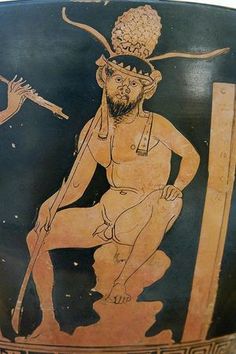 an ancient greek vase with a man holding a spear