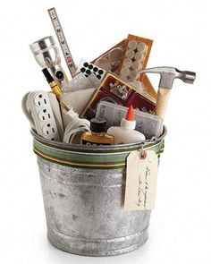 a metal bucket filled with lots of assorted items