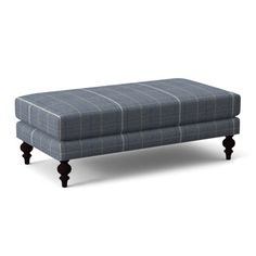 a blue plaid ottoman with wooden legs on an isolated white background for use as a footstool