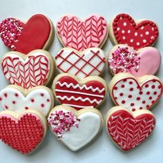 heart shaped cookies are arranged on a table