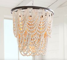 a white chandelier hanging from the ceiling