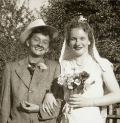 an old black and white photo of a bride and groom