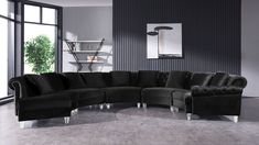 a large black sectional couch sitting in a living room