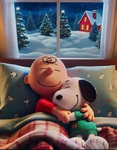 a cartoon character hugging a stuffed dog on top of a bed