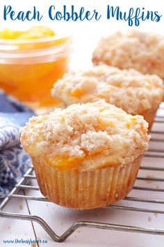 two muffins sitting on top of a cooling rack