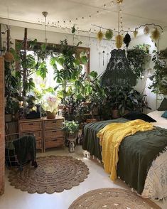 a bedroom with plants and rugs on the floor