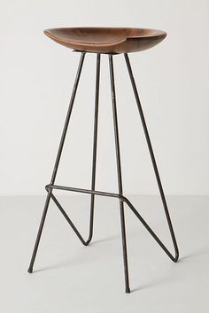 the backless stool is made from metal and wood