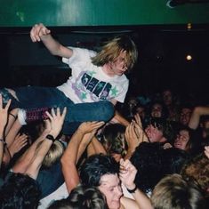 a man on top of a crowd of people