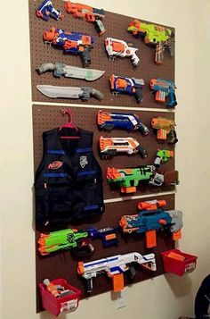 Peg board display for "nerf/airgun collection Peg Board Walls, Nerf Mods, Kid Furniture, Plastic Soldier, Nerf Toys, Lego Inspiration, Boys Playroom, Future Room, Boys Rooms