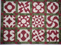 a red and green quilted wall hanging