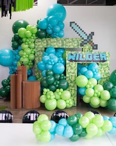 a bunch of balloons that are in the shape of a video game character and an image of a house