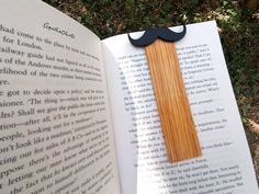 an open book with a fake mustache on it