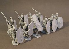 several toy soldiers with shields and swords