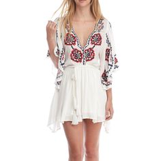 Take A Walk On The Wild Side With The Free People Cora White Embroidered Dress! Intricate Navy Blue, Red, And Beige Embroidery Decorates This Flirty Woven Dress With A Scalloped, Plunging Neckline And Wide, Fluttering Sleeves With Side Slits. Elastic Waistband, And An Tasseled, Wrap Belt Tops A Leg-Baring Mini Skirt. Skirt Is Lined. 100% Viscose. Machine Wash Cold. Imported. Embroidered V-neck Vacation Dress, Bohemian V-neck Embroidered Dress For Brunch, V-neck Dresses With Embroidered Hem For Brunch, White V-neck Embroidered Dress For Festival, Flowy V-neck Embroidered Dress, Folk Style V-neck Dress For Vacation, Folk Style V-neck Dress With Embroidered Hem, Red V-neck Embroidered Summer Dress, Red Embroidered V-neck Dress For Summer