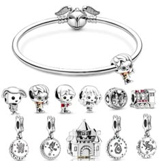 an assortment of charms and bracelets on a white background