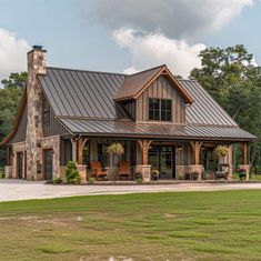 a large house with a metal roof and lots of windows