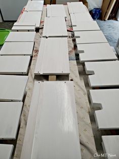 several pieces of white wood sitting on top of a table