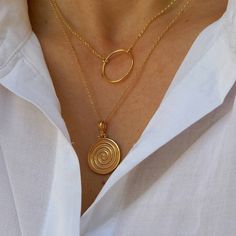 14k gold-filled floating necklace with an eye-catching Ancient Greek Spiral Pendant hanging on high quality 14k gold filled chain. Dainty everyday necklace. Ancient Greek Spiral is a symbol of infinity, of constant motion. Ideal gift! Complete the set: https://www.etsy.com/listing/1104147517/spiral-bracelet-bracelet-in-14k-gold?click_key=7ef248893cbaf975dd7625d86705068a8dbea0d2%3A1104147517&click_sum=afbaa32d&ref=shop_home_active_8&pro=1&frs=1 https://www.etsy.com/listing/1249712854/spiral-ring- Handmade Spiral Yellow Gold Jewelry, Gold Plated Spiral Jewelry, Minimalist Gold Spiral Jewelry, Gold Spiral Necklace As A Gift, Gold Spiral Necklace For Gifts, Gold Spiral Necklace For Gift, Spiral Gold-plated Jewelry, Gold Spiral Necklaces For Jewelry Making, Spiral Brass Necklace For Gift