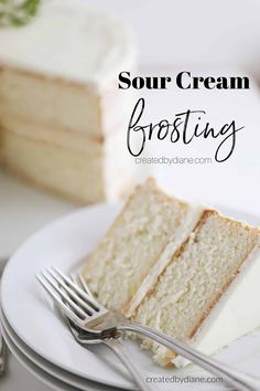 a slice of white cake on a plate with a fork and knife next to it