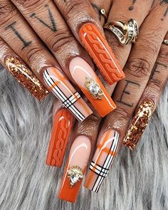 For those who love intricate designs, these burnt orange and gold acrylic nails are a masterpiece. The combination of burnt orange polish, gold glitter, and detailed line work creates a luxurious and eye-catching look.   Photo credit by: @lizthenailtechwiz Toe Nail Designs For Fall, Fall Manicures, Burnt Orange Nails, Fall Toe Nails, Korean Toner, Gold Acrylic Nails, Orange Nail Designs, Orange Nail, Girl Nails