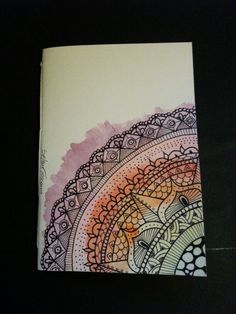 a notebook with an intricate design on it