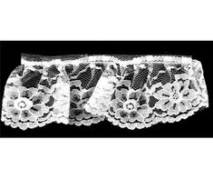 three white lace garters with flowers on them