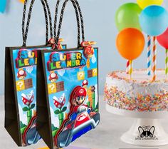 two paper bags with mario kart on them and some balloons in the air behind them