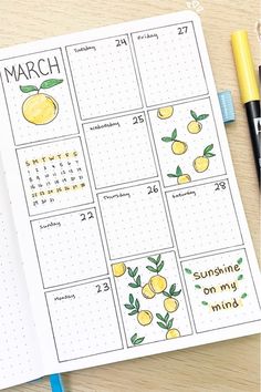 a calendar with lemons drawn on it next to some markers and pencils,