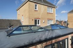 an image of a house with a skylight on the roof and some windows in it