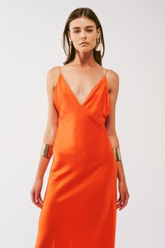 Introducing our stunning Satin Maxi Dress with Spaghetti Straps in Orange, perfect for your next special occasion! This dress features a maxi length, creating an elegant and sophisticated look that will turn heads wherever you go. The V-neckline and sleeveless style add a touch of femininity, while the relaxed fit provides comfort and ease of movement. The dress is made with a luxurious satin fabric that drapes beautifully over the body, giving you a flattering silhouette. The open back design a Orange Satin, Style Party, Satin Maxi, Satin Maxi Dress, Party Fashion, Stunning Dresses, Belted Dress, Alternative Fashion, Satin Dresses