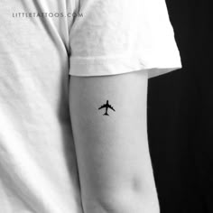 a small airplane tattoo on the left inner arm by littletattoos com, via littletattoos com