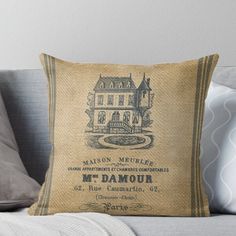 an old fashioned pillow with the label for m - damour on it throw pillow