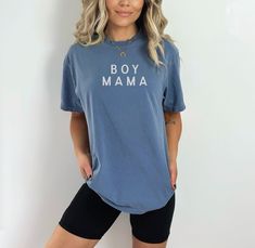 The Boy Mama Simplistic Neutral Tee offers a timeless, relaxed fit with a soft, lived-in feel that makes it perfect for everyday wear. Featuring a classic crew neckline and a clean, minimalist design, this tee is screen-printed with environmentally safe inks for durability. Its neutral color palette ensures easy styling, whether you’re pairing it with jeans, leggings, or shorts. For long-lasting quality, wash the tee inside out on a gentle cycle with cold or lukewarm water, and tumble dry low or line dry. Colors may vary slightly based on your device’s display settings. Mama Shirts Vinyl, Boy Mom Tshirt, Baby Bow Hats, Stylish Boy, Delivery Gown, Boy Mama, Nursing Wear, Newborn Gown, Going Home Outfit